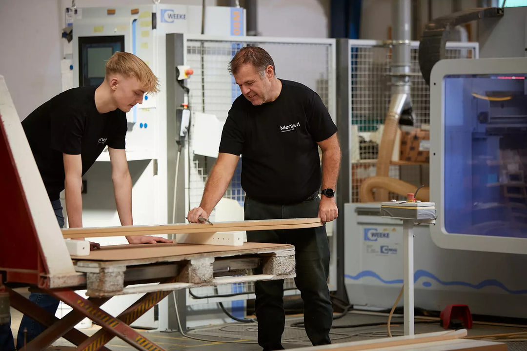 Manis-h team members working on children’s furniture at our factory in Denmark.